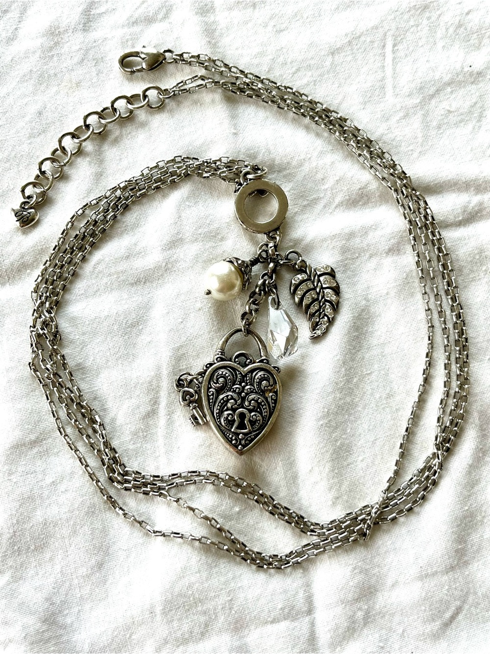 Silver toned Brighton Heart Locket Necklace with Charm Accents